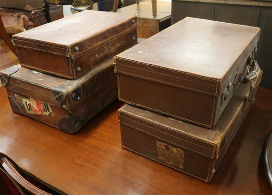 Four leather suitcases